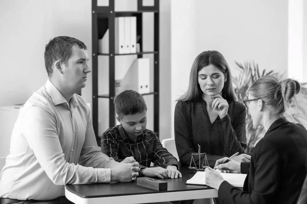 Family Lawyer In Robina Consulting With Family And Child