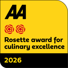 A yellow sign that says aa rosette award for culinary excellence 2025