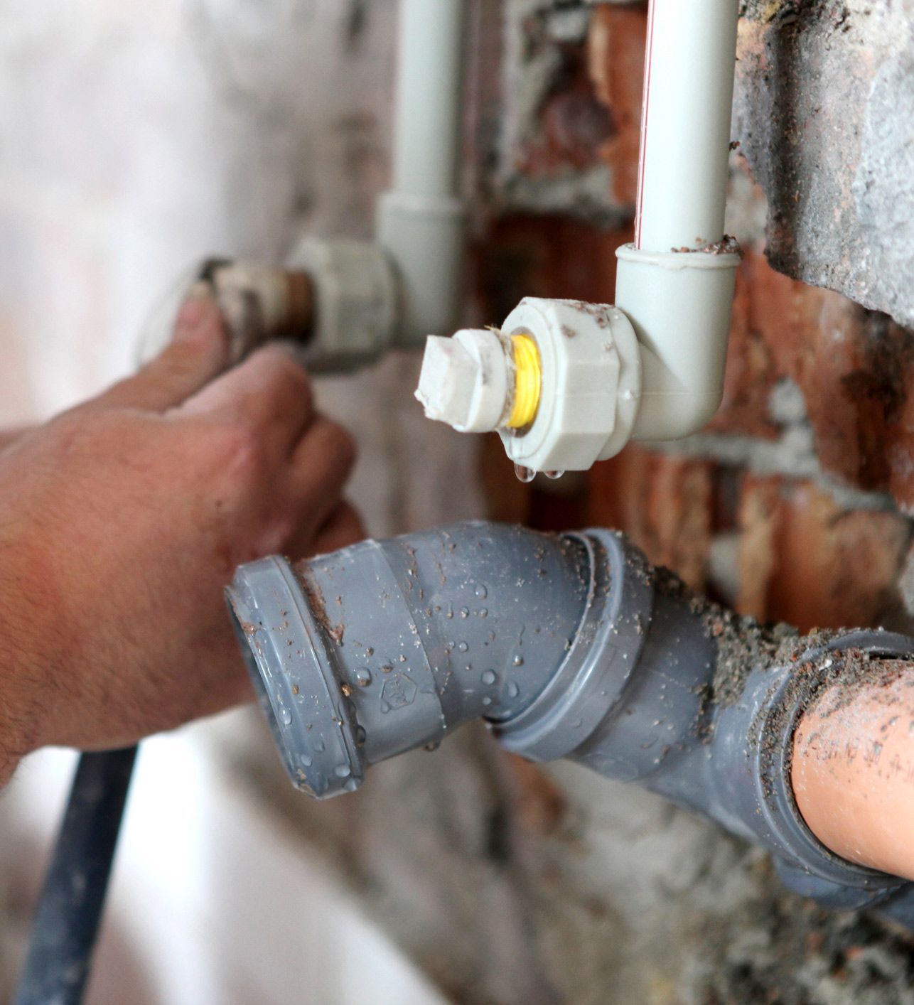 Plumber Working on Pipes — Lisle, IL – Jim Dhamer Plumbing and Sewer, Inc. Plumber Working on Pipes — Lisle, IL – Jim Dhamer Plumbing and Sewer, Inc.