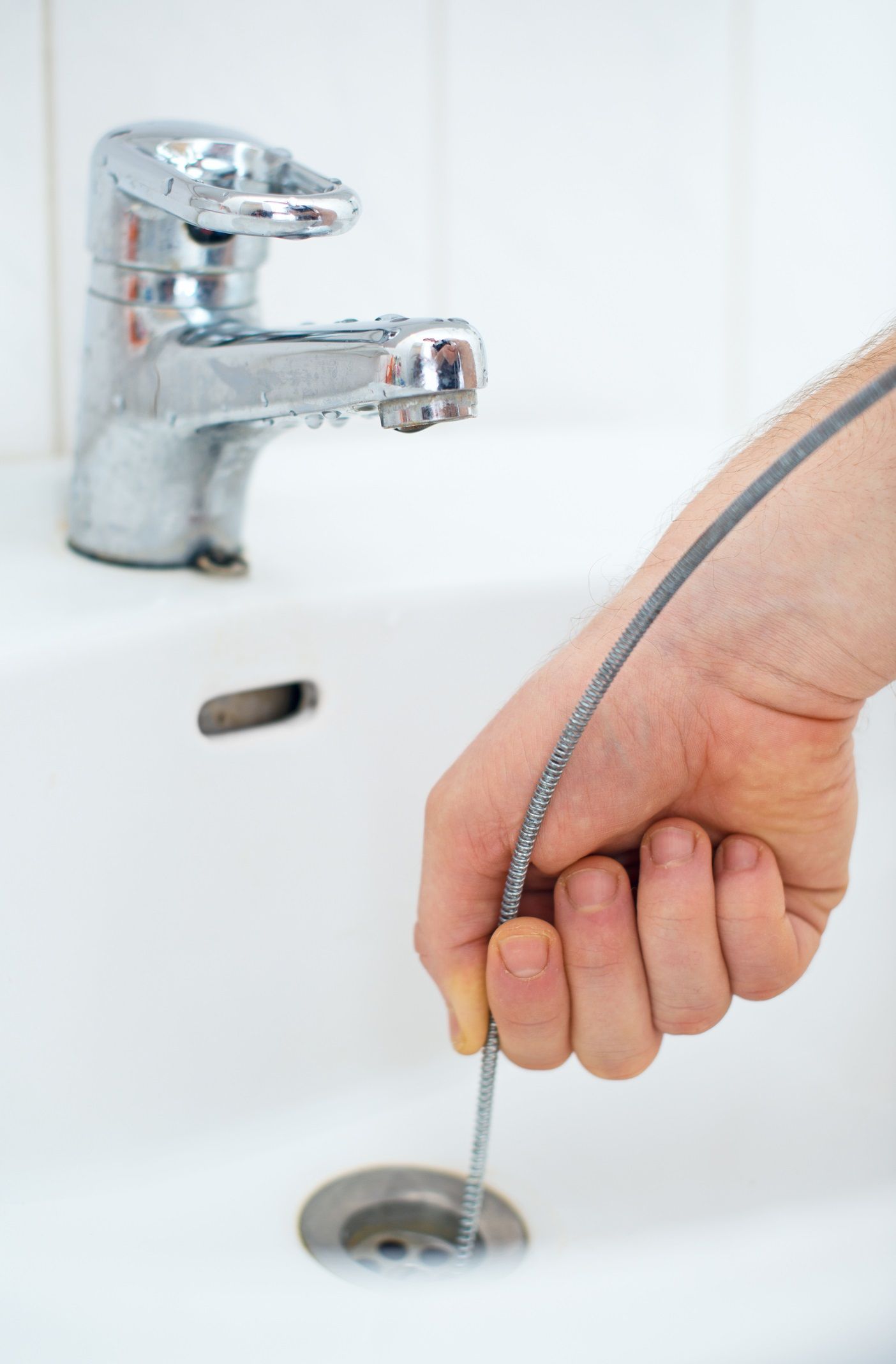 Plumber from Dhamer Plumbing & Sewer, Inc. working at a customer's house in Naperville, IL.