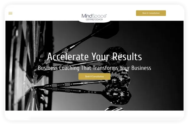 Mindspace Business Coaching website homepage, with darts reflecting on glass;