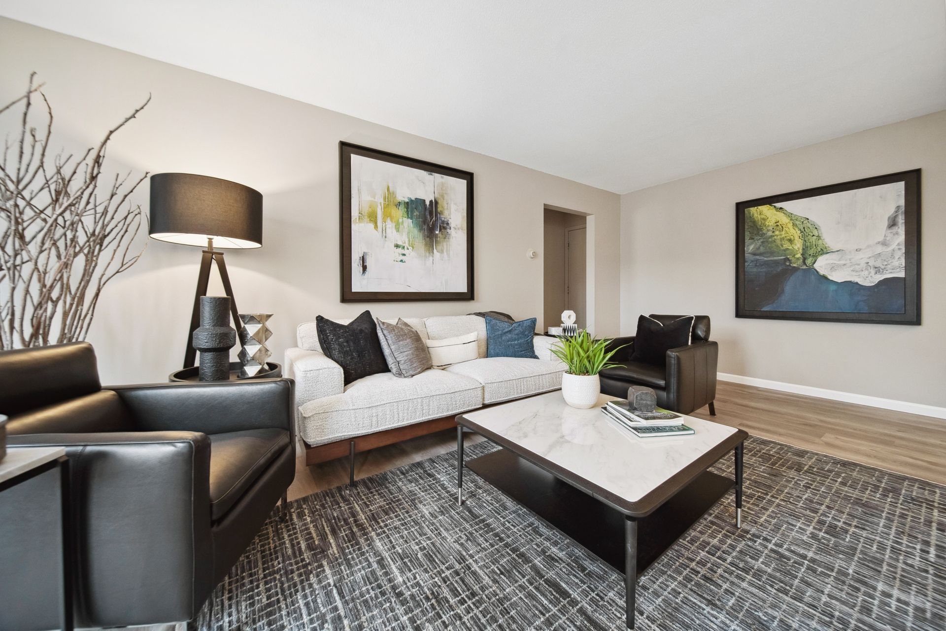 apartment living room with modern furniture - Skyline Real Estate Services