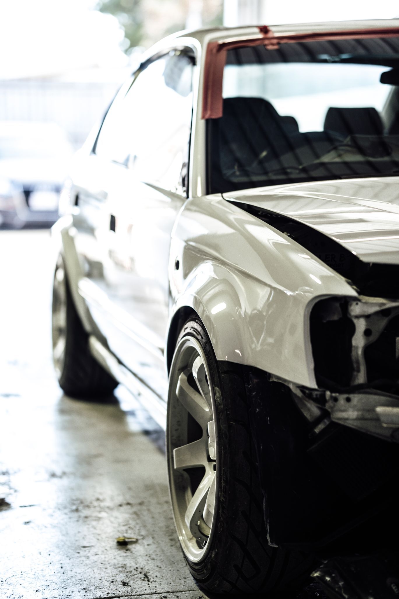 Side View Of A White Car — Panel Beaters in Southport, QLD
