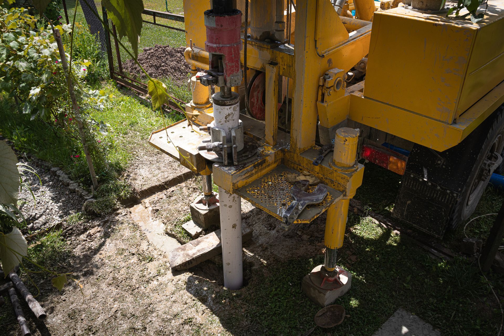 A drilling machine making a hole on the ground.