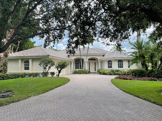 An aerial view of a house with a tiled roof installed by Four Peaks Roofing in Bonita Springs