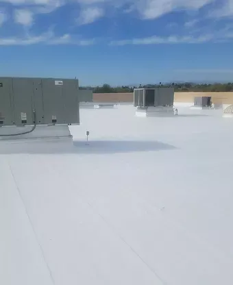 A white commercial roof built by Four Peaks Roofing in Fort Myers