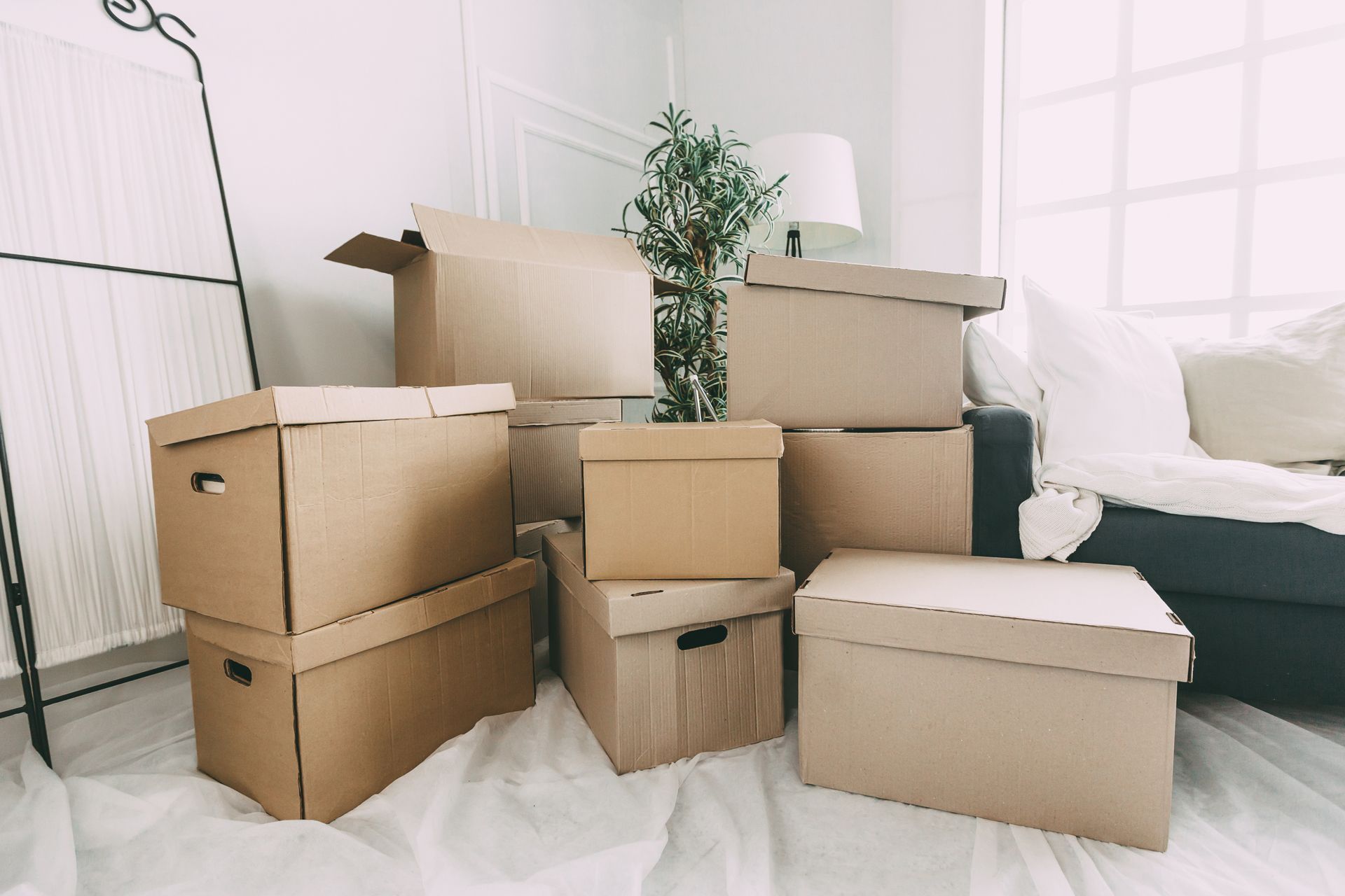 Boxes stacked in a living room