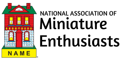 Logo for National Association of Miniature Enthusiasts with a small house and nameplate