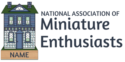 Logo for National Association of Miniature Enthusiasts with a small house and nameplate
