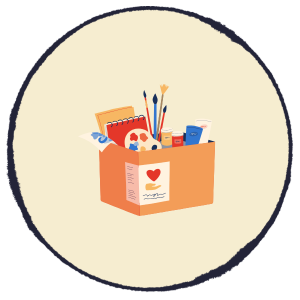 Orange gift box with art supplies and stationery on a cream circle background