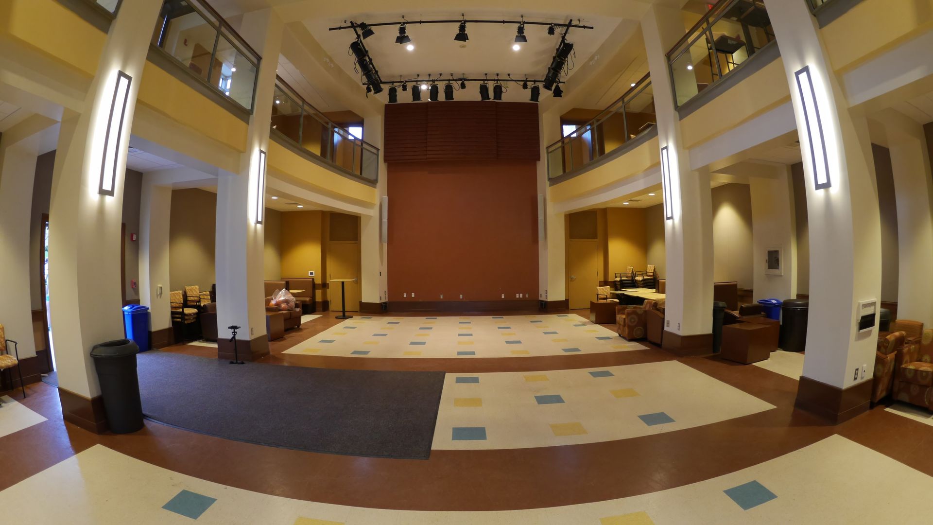 A large room with a stage in the middle of it