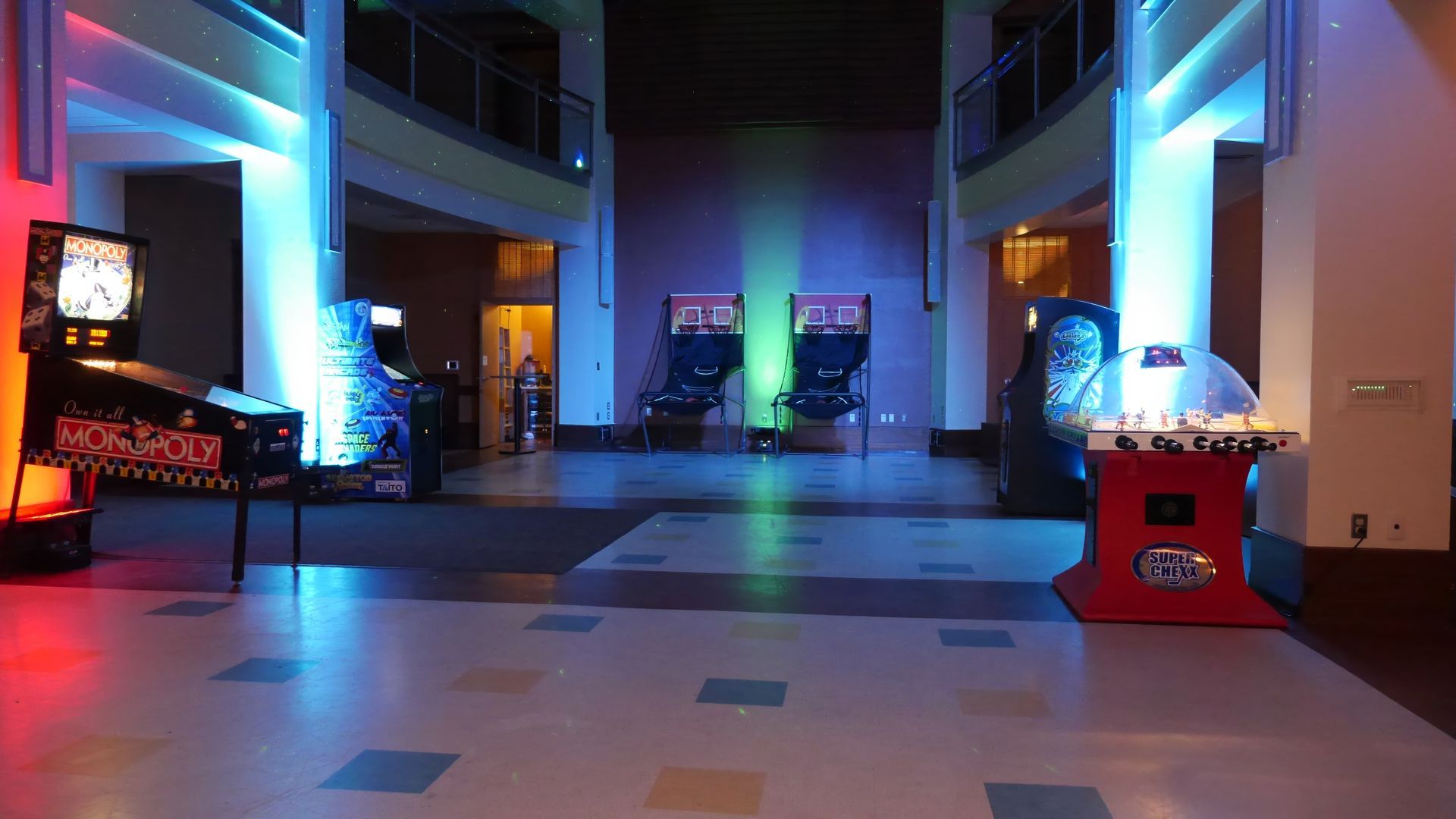 A room with a lot of arcade games in it