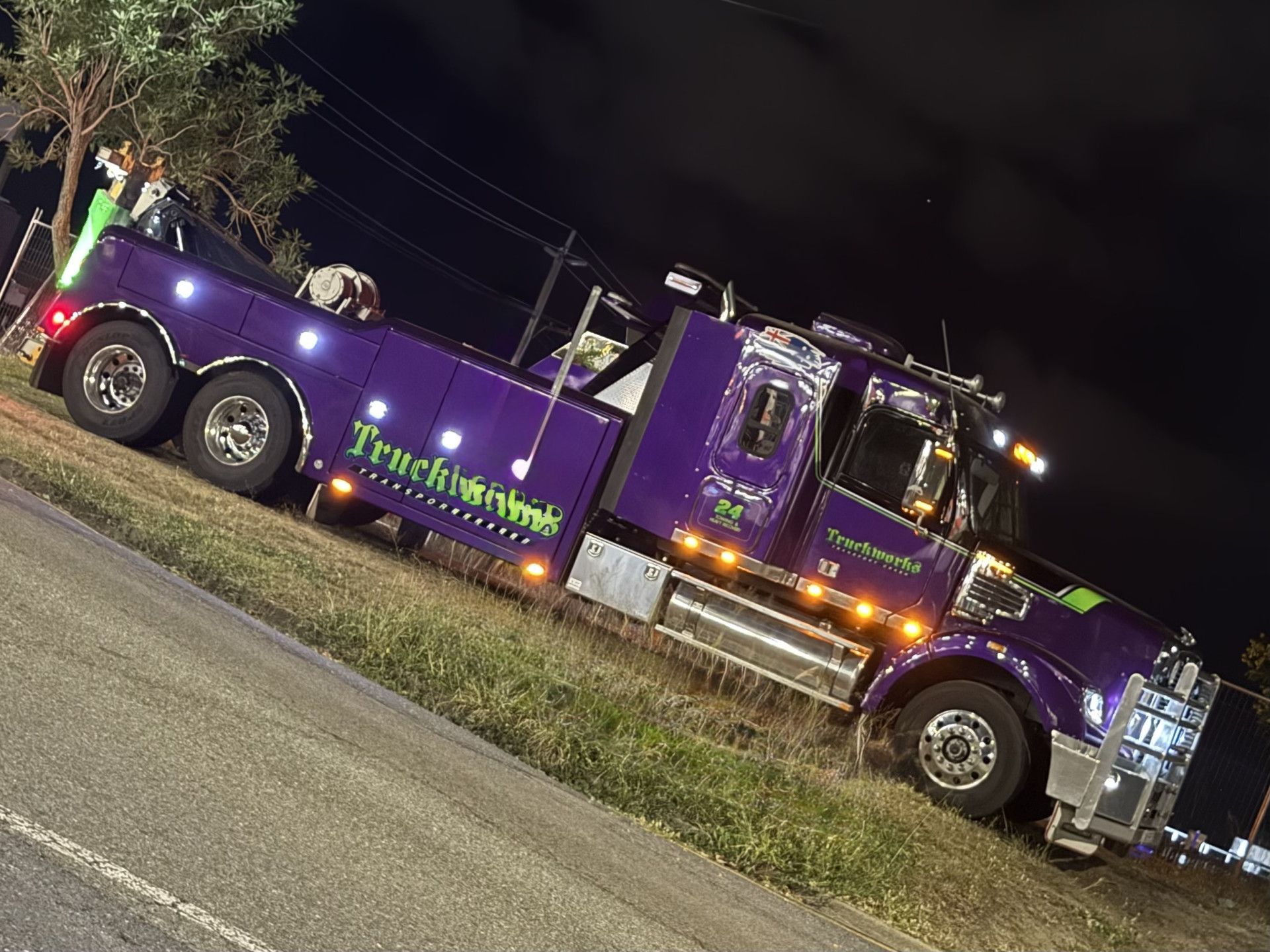 Purple tow truck with 