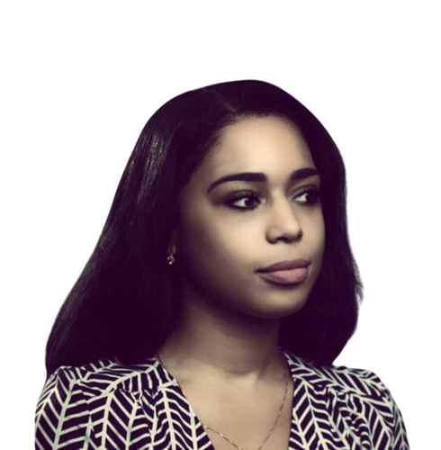 A woman wearing a black and white striped shirt looks to the side