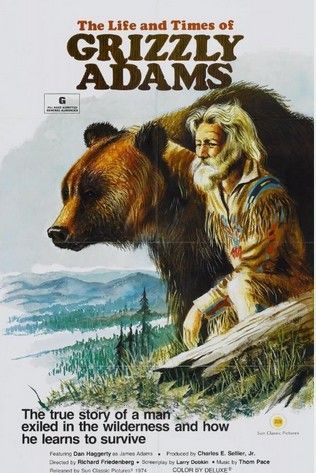 Movie poster of Grizzly Adams with bear, wilderness scene.