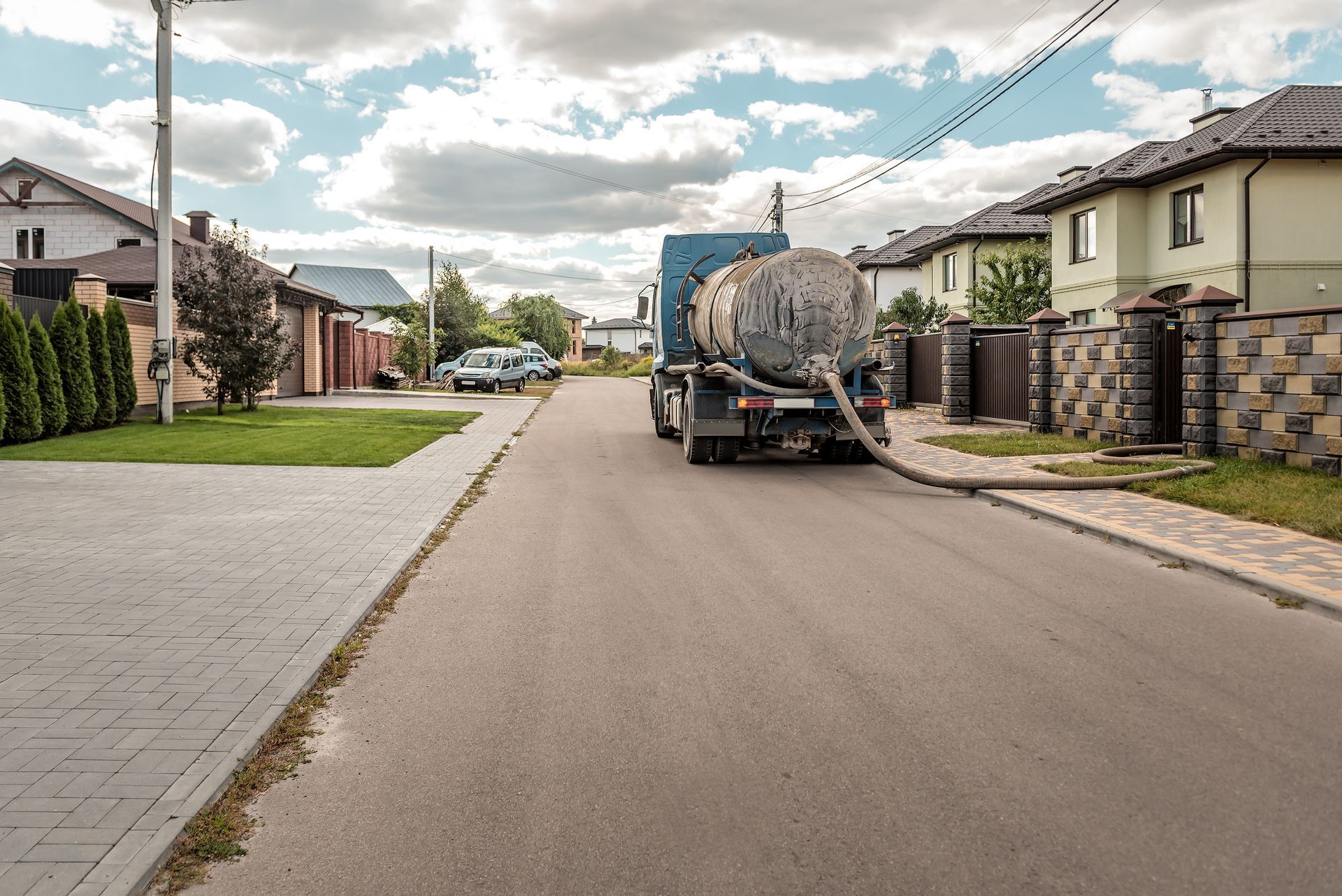 Sewage Tank truck. Sewer pumping machine on the street - Septic Tank Pumping