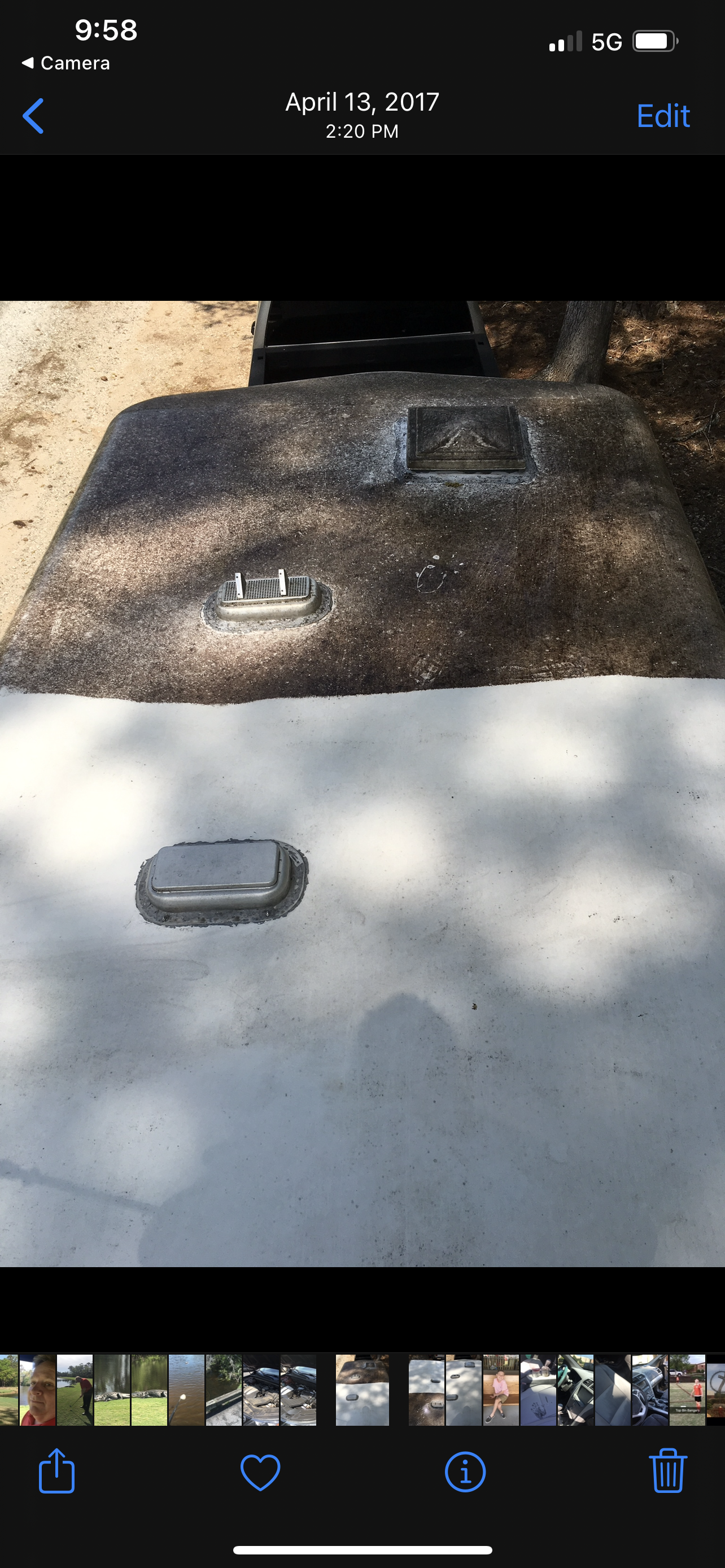 A concrete surface with two embedded fixtures. One is raised and rectangular, the other is a small oval.