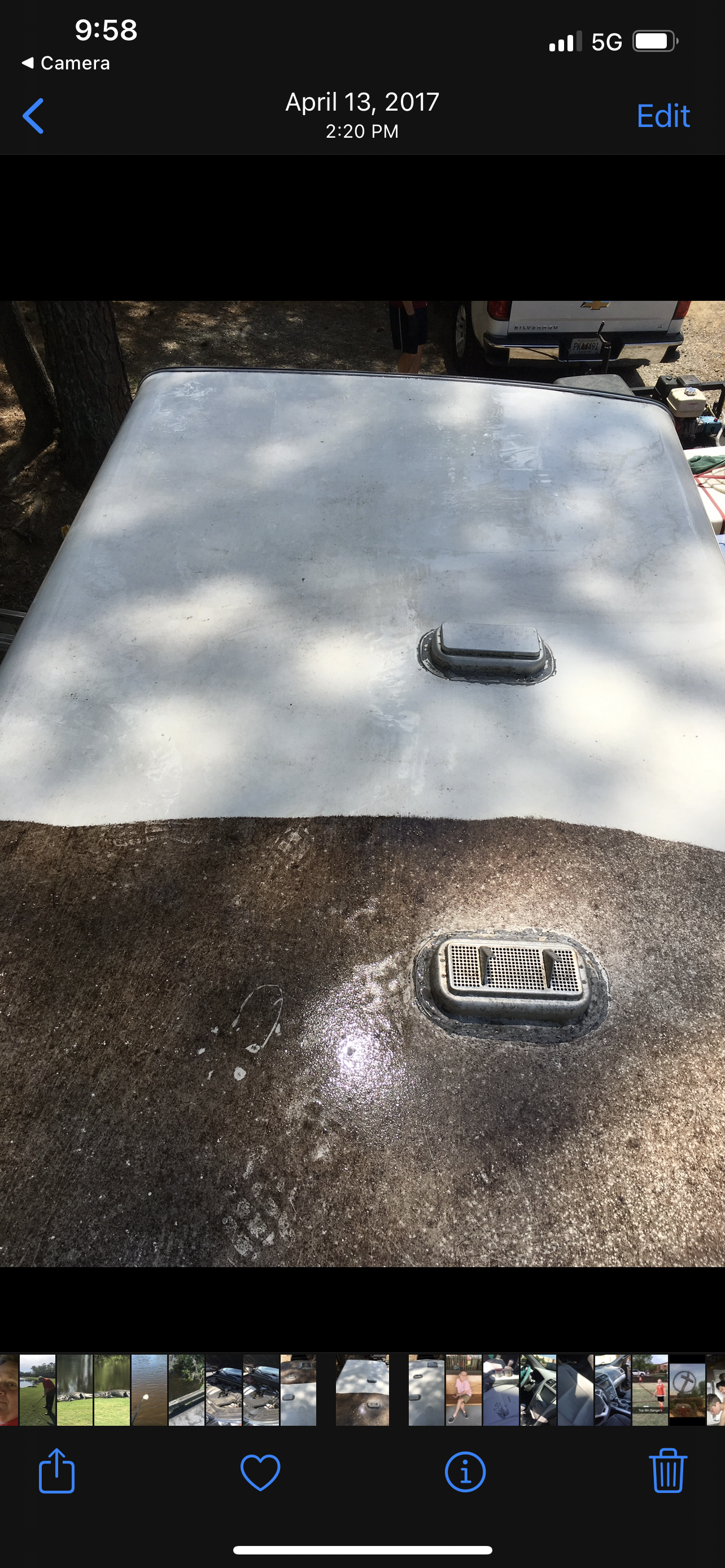 A rectangular structure with a handle and a rectangular plate that says 