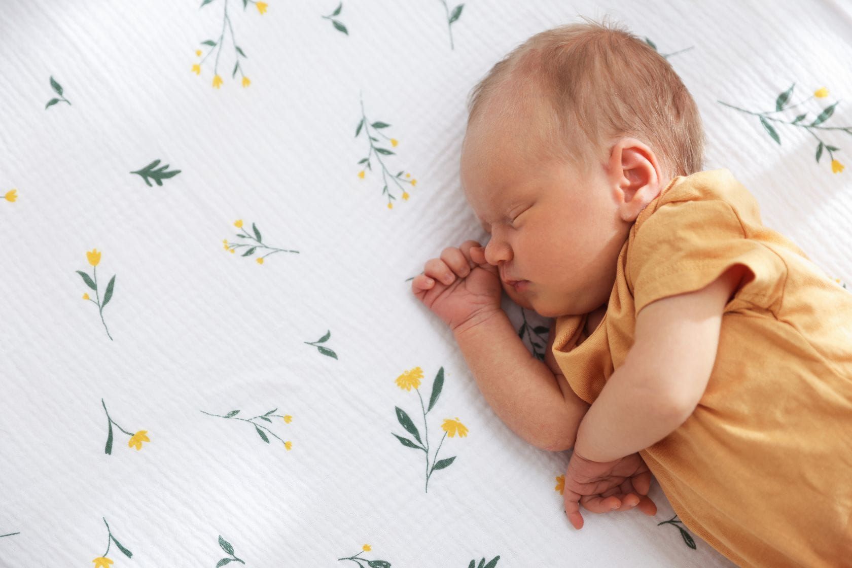 Newborn baby sleeping peacefully, illustrating Montessori-inspired healthy infant sleep.