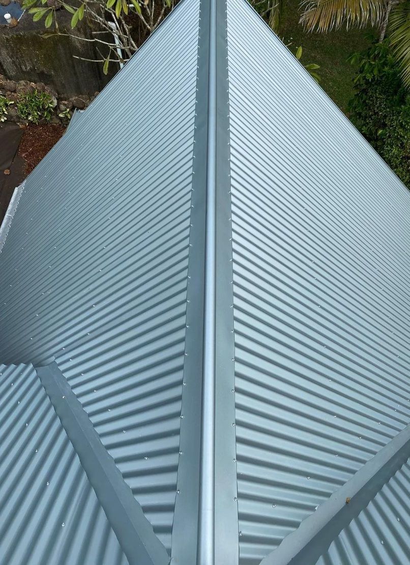 A Close Up of a Metal Roof With a Gutter on It — Northern Rivers Metal Roofing PTY LTD In Brunswick Heads, NSW