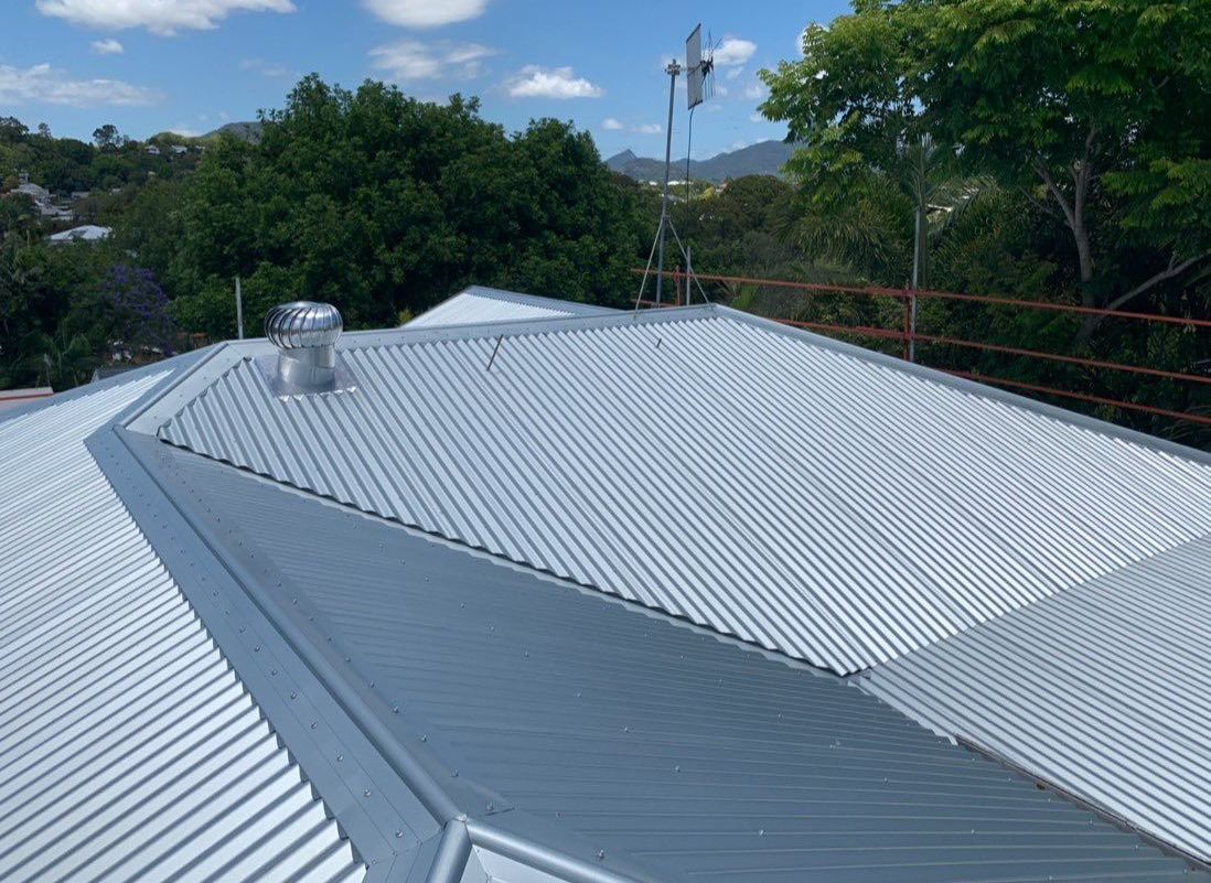 The Roof of a House With a Bird Sitting on Top of It — Northern Rivers Metal Roofing PTY LTD In Byron Bay, NSW
