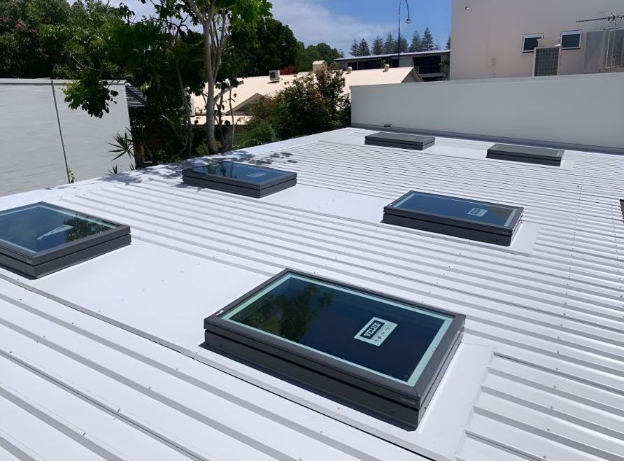 A White Roof With Three Skylights on It  — Northern Rivers Metal Roofing PTY LTD In Mullumbimby, NSW