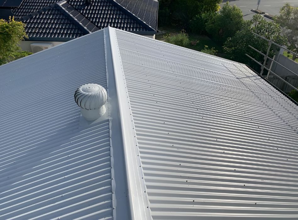 A white roof with a fan on top of it -Northern Rivers Metal Roofing PTY LTD
