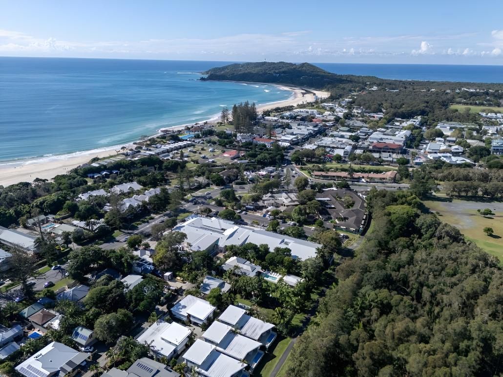 Aerial View of a Coastal Town With a Beach, Ocean, and Green Trees — Northern Rivers Metal Roofing PTY LTD In Ewingsdale, NSW