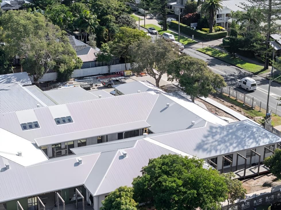 Building With a White Roof Under Construction — Northern Rivers Metal Roofing PTY LTD In Tweed Heads, NSW