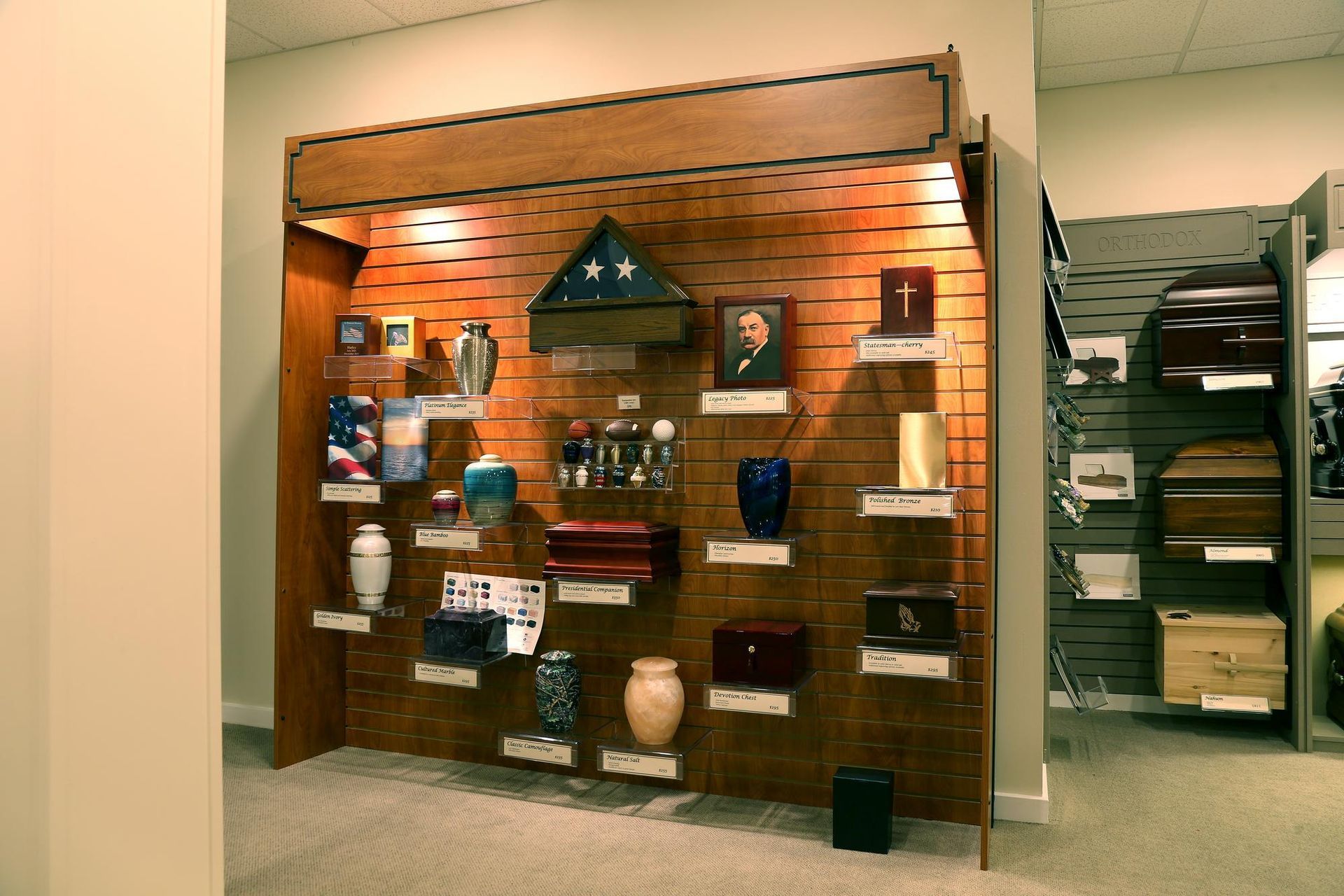 Museum display of assorted handbags and purses on wooden wall shelves in a gallery-like store.