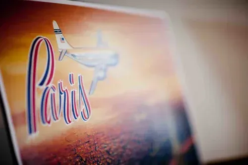 Paris poster with Eiffel Tower silhouette in warm sunset colors