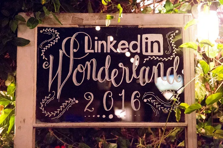 LinkedIn Wonderland 2016 sign on a floral backdrop with warm lights