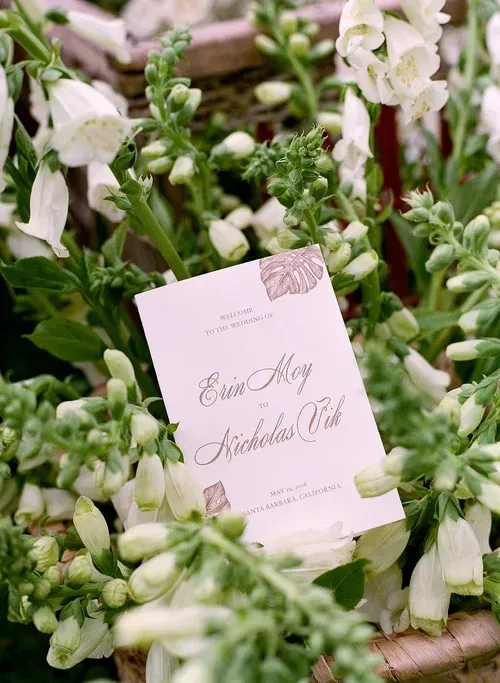Pastel flower arrangement with a pink place card in the center