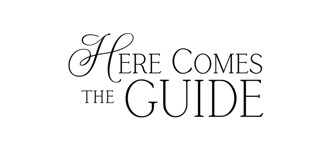 Stylized black text reading “Here Comes the Guide” on a white background