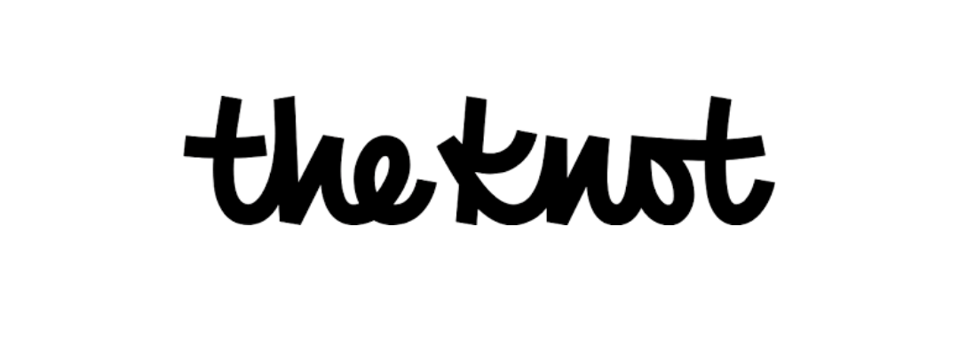 Black cursive text reading “the knot” on a white background