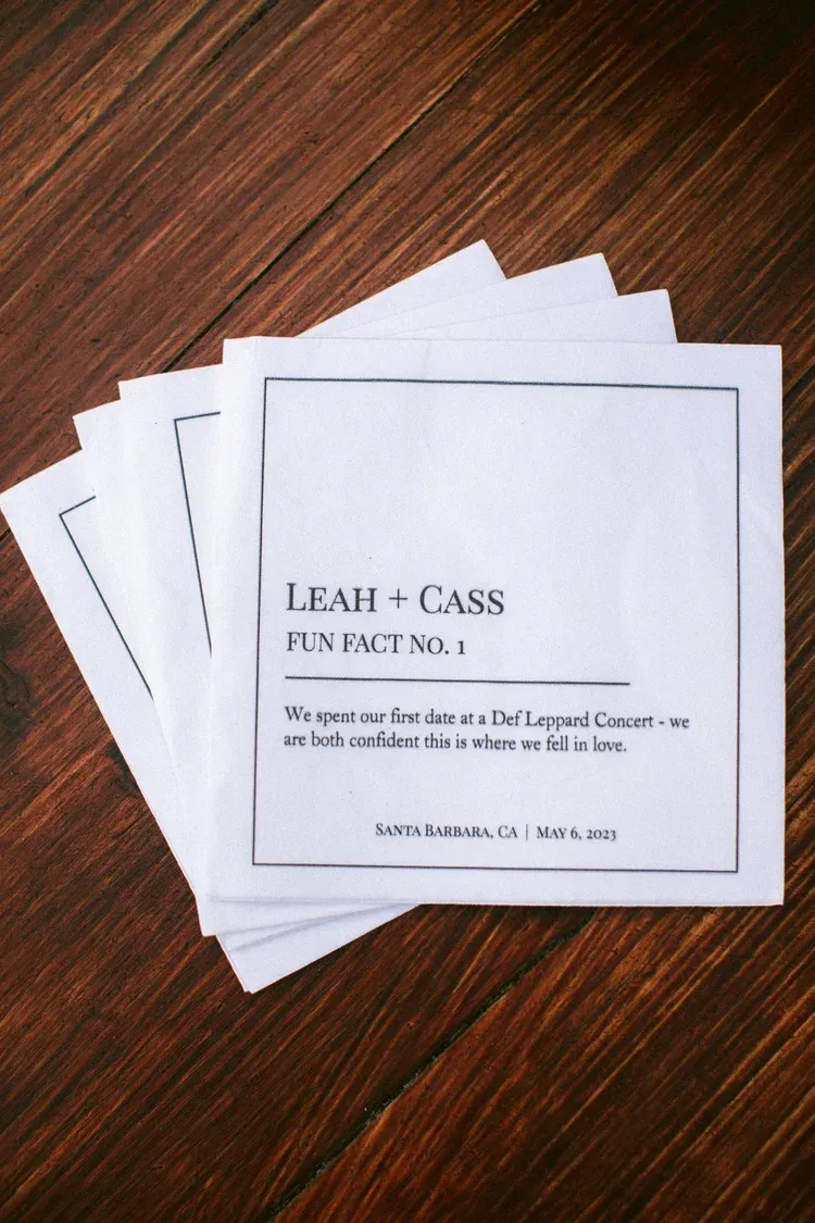 Stack of white business cards on a wooden table.