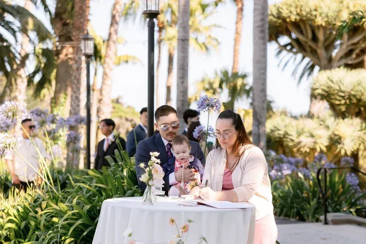 Family at a decorated outdoor table at a sunny garden event