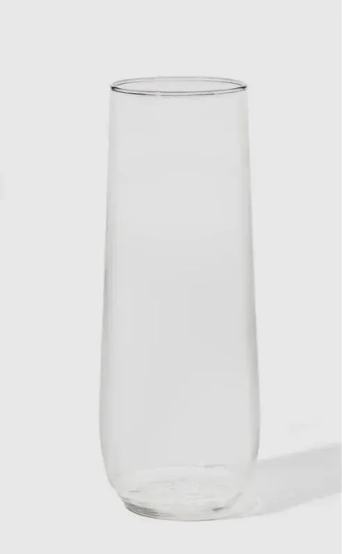 Clear empty drinking glass on a white background