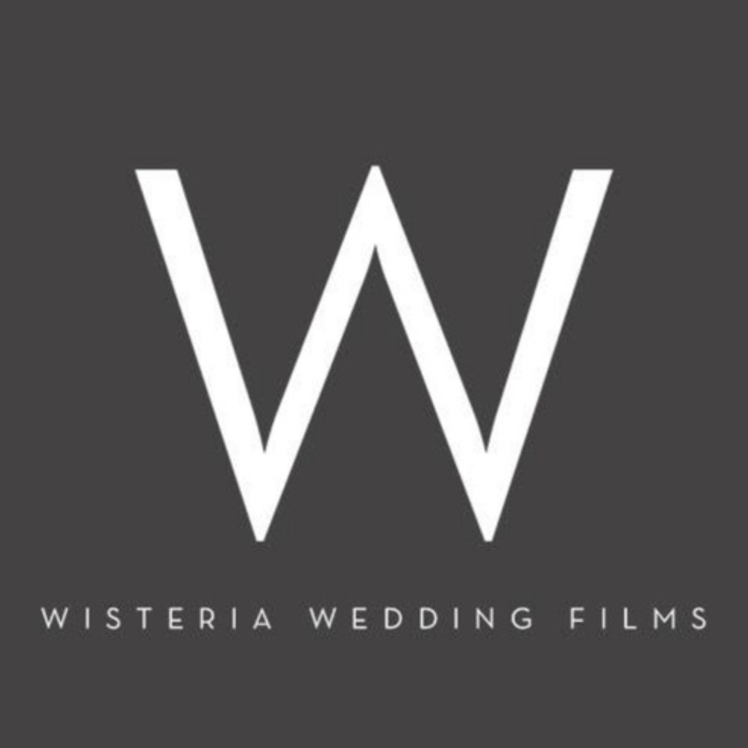White “W” logo with Wisteria Wedding Films on a gray background