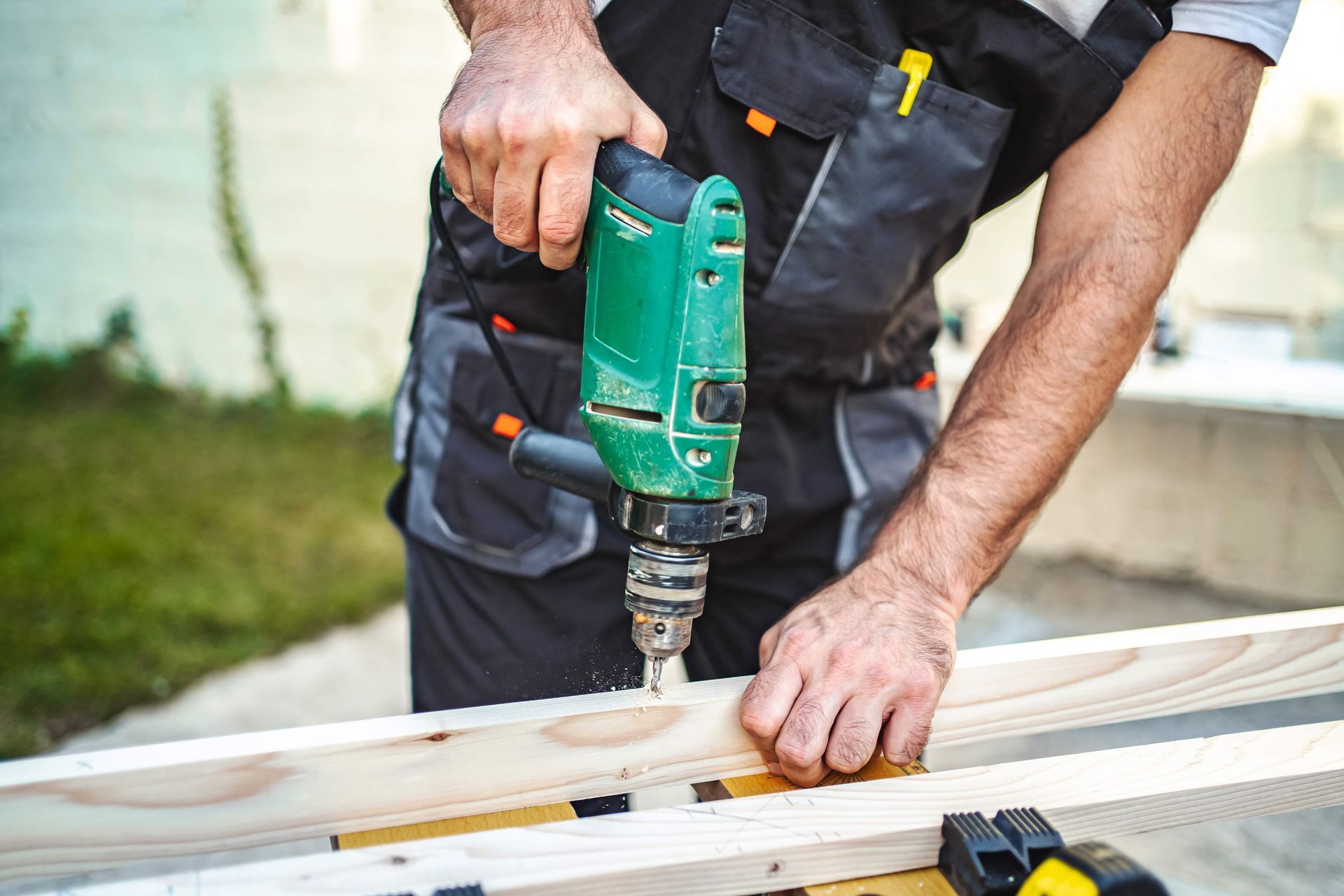 Man drilling wood Man drilling wood