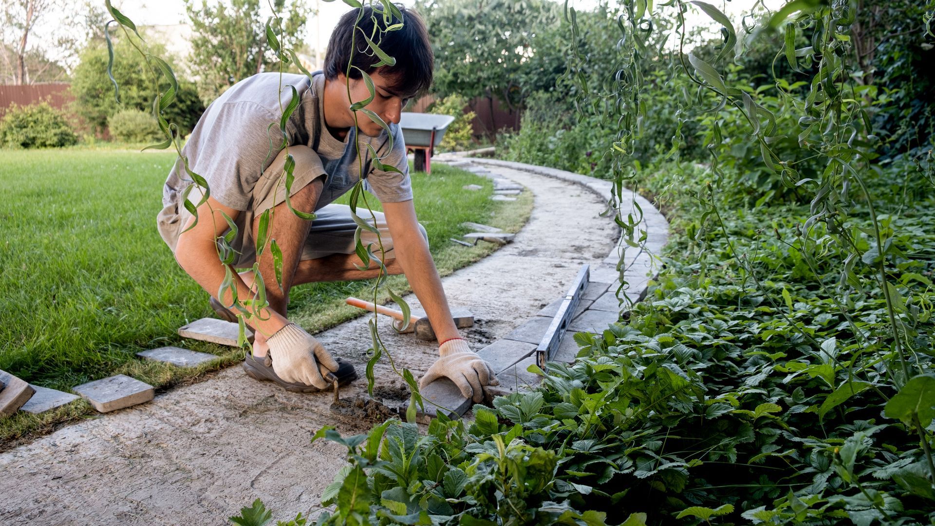 Man laying garden path