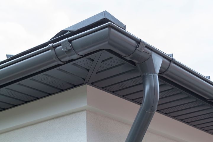 Corner Of House With New Gray Metal Tile Roof — Berlin, MD — Eastern Shore Gutters