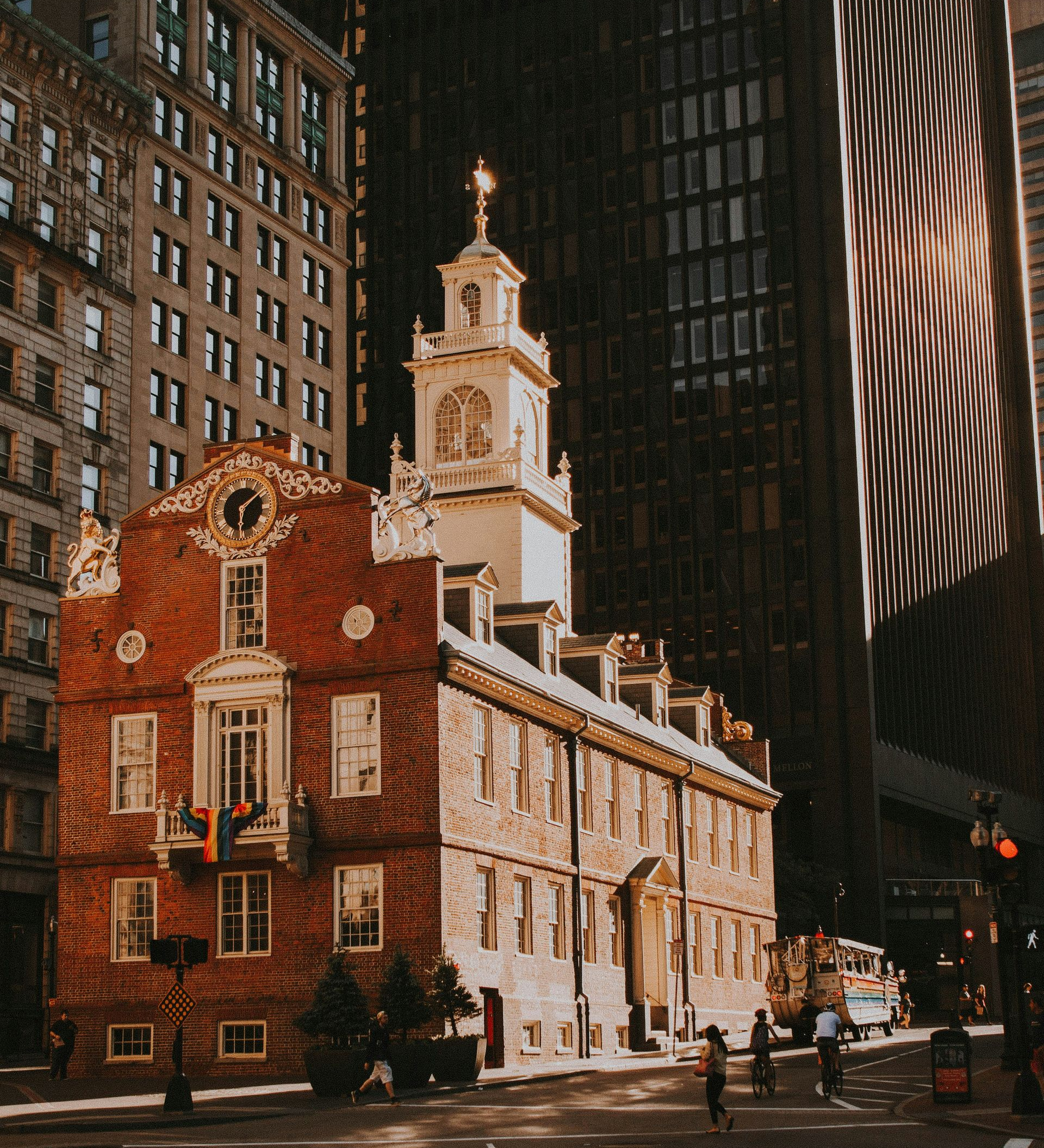 Old State House in Boston, a historic brick building with a clock tower, surrounded by modern skyscrapers.
