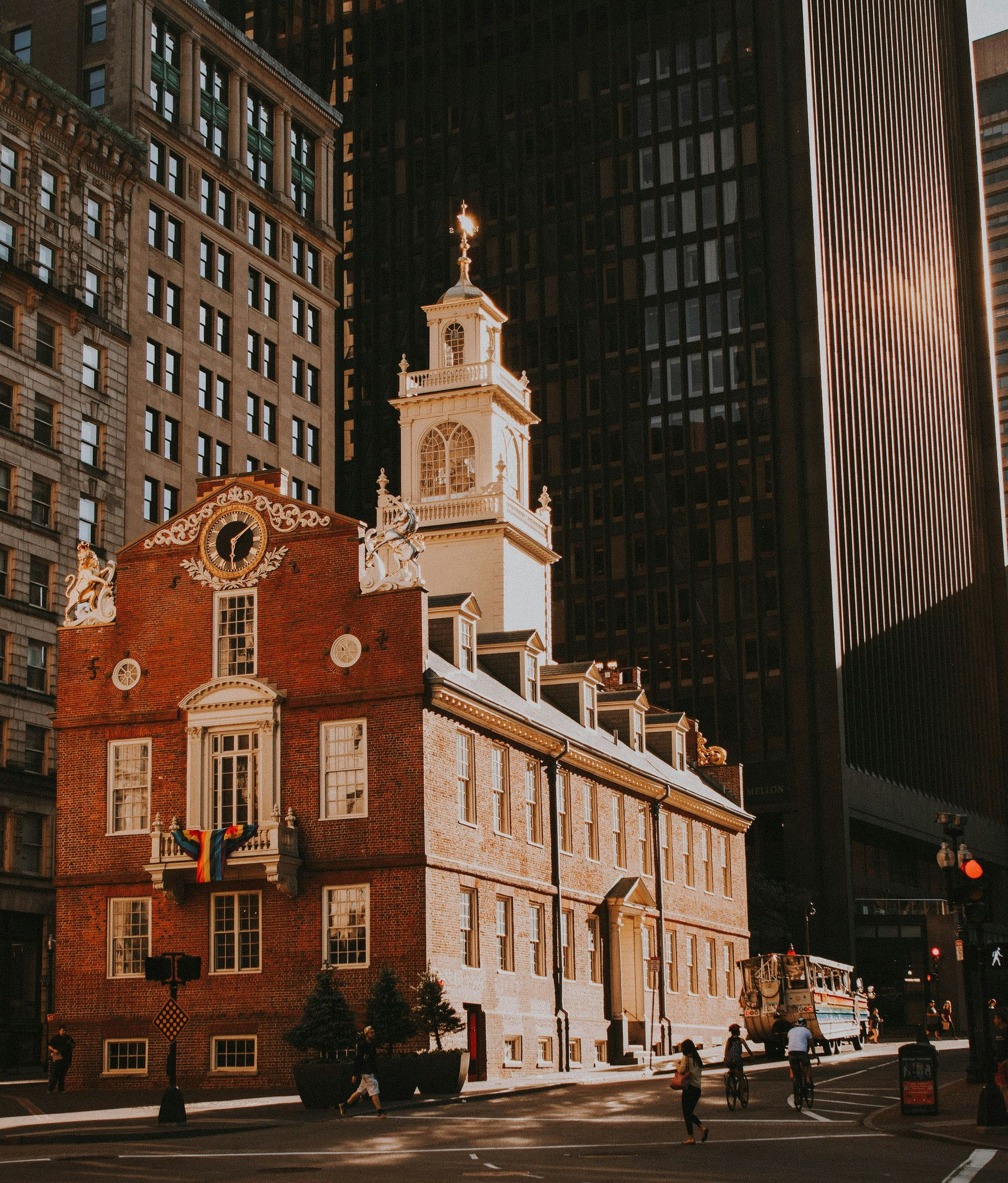 Old State House in Boston, a historic brick building with a clock tower, surrounded by modern skyscrapers.
