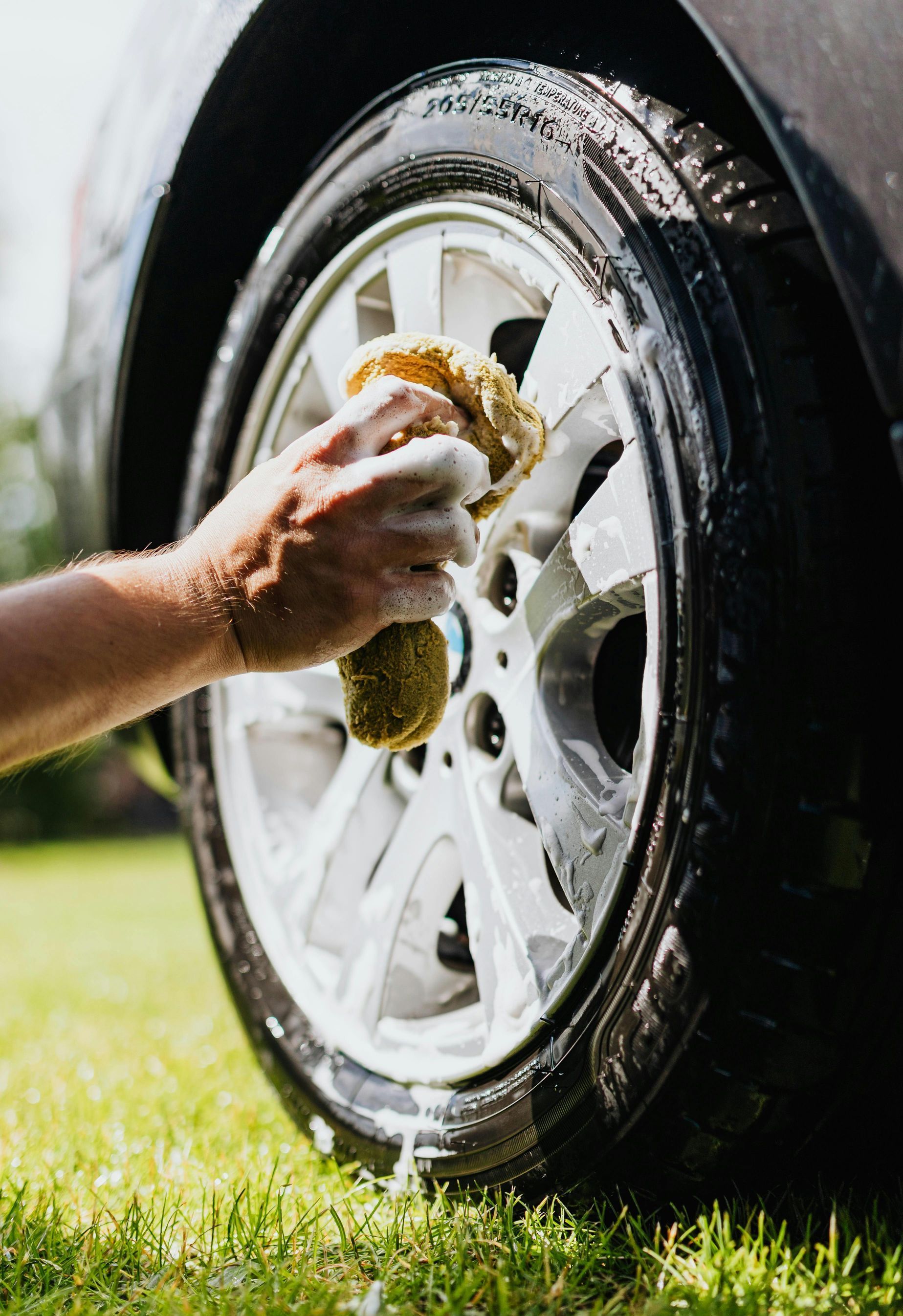 A man is working on a tire in a tire shop.