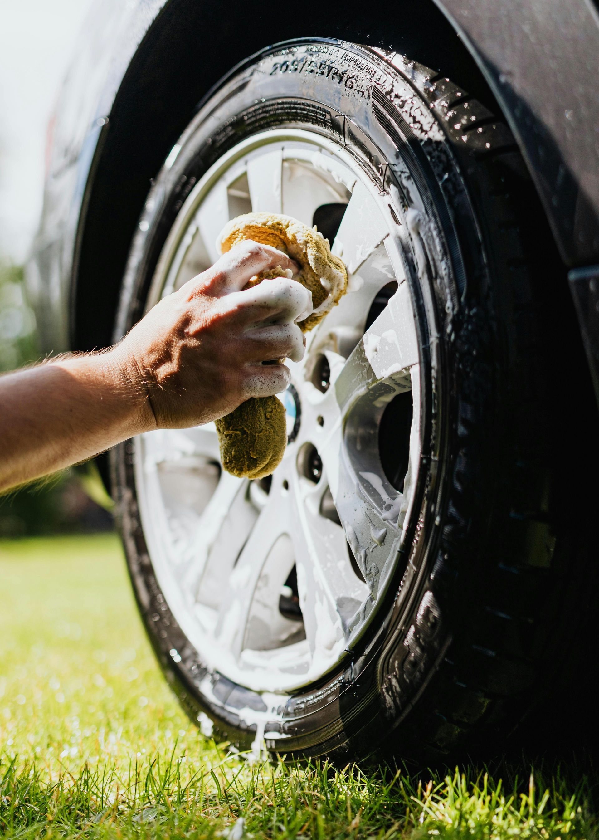 A man is working on a tire in a tire shop.