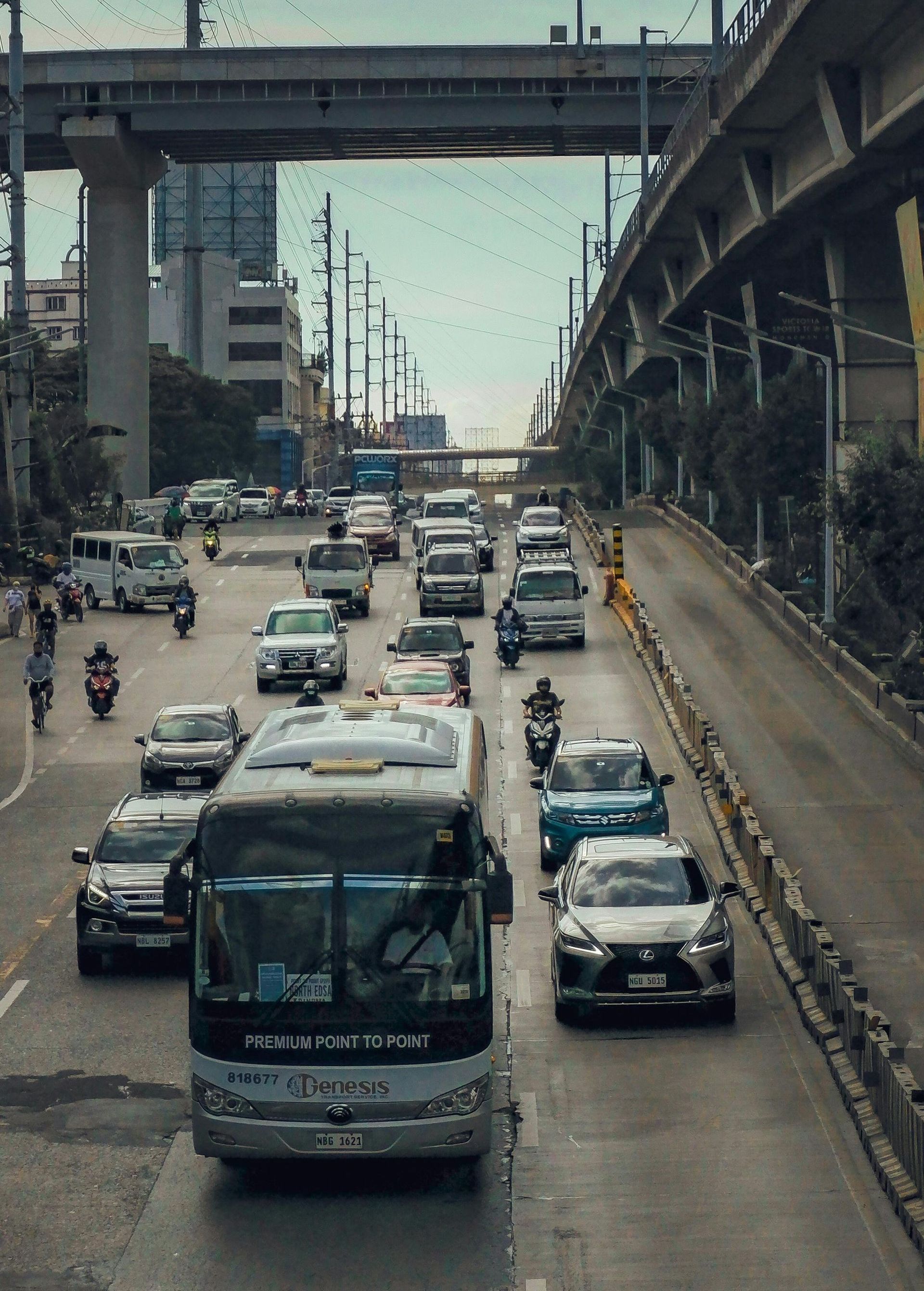 A bus is driving down a busy city street.