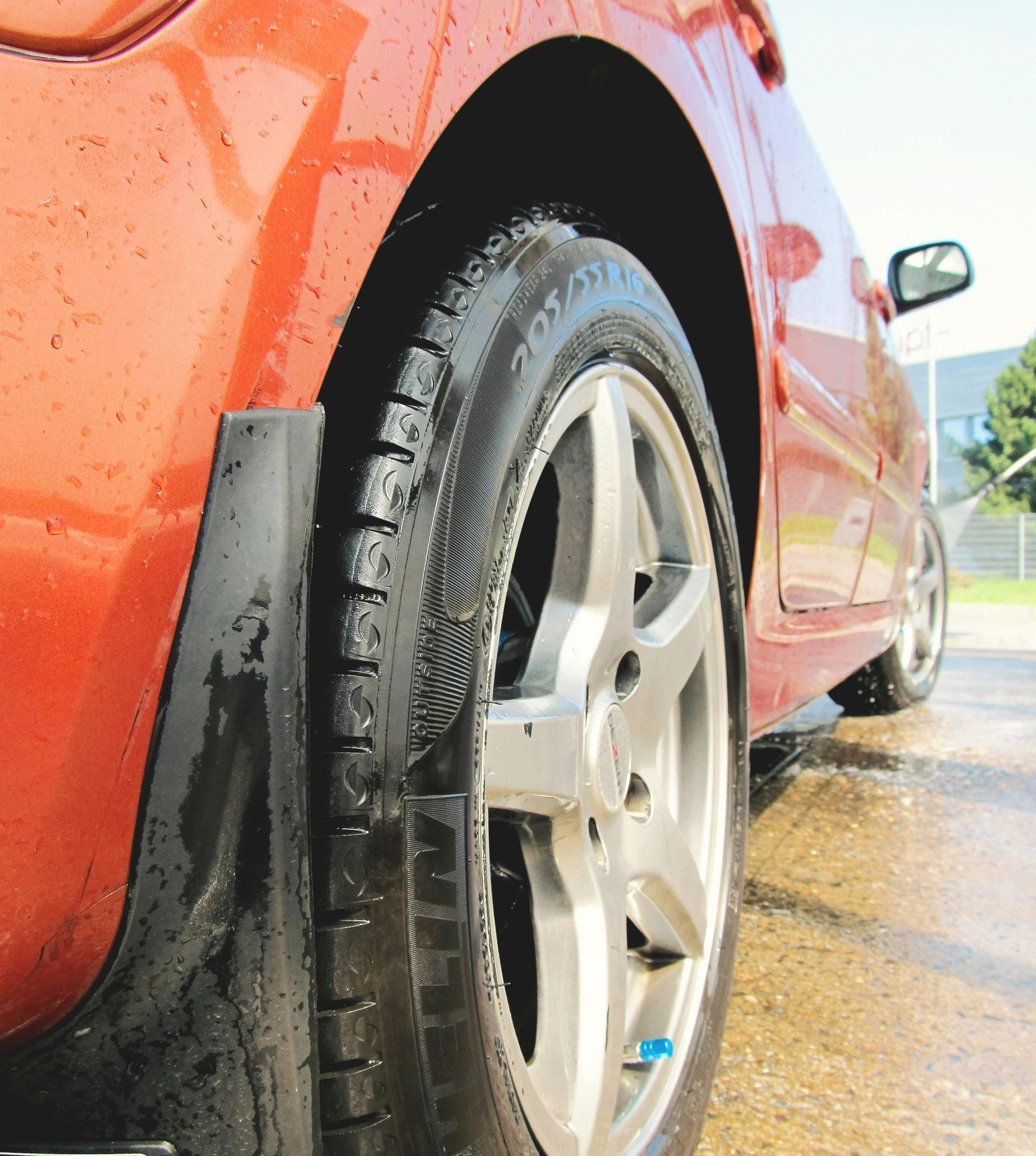 A close up of a car wheel and tire