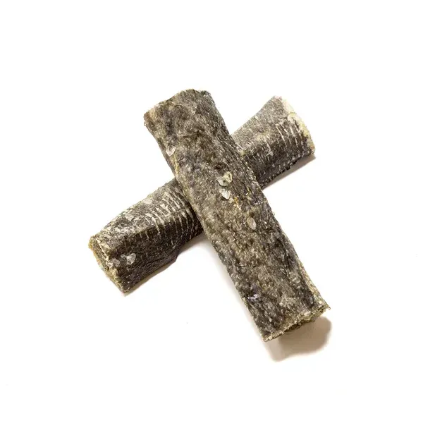 Two cross-shaped dark brown textured sticks on a white background