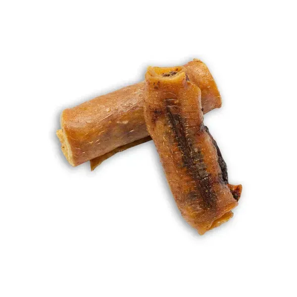 Two dried chew sticks crossed on a white background